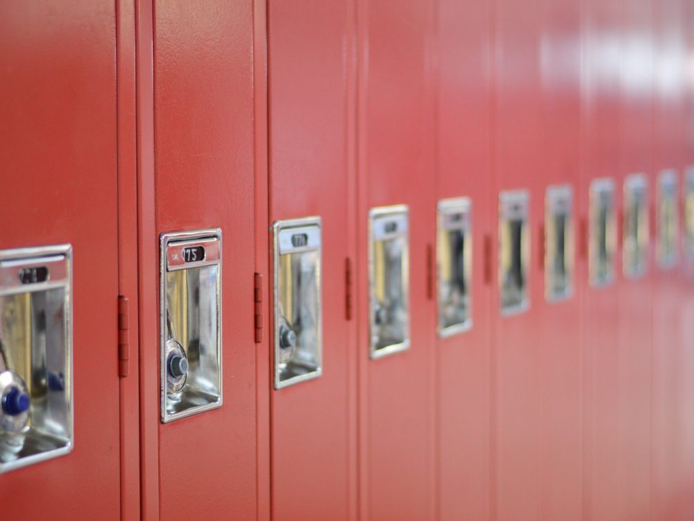 red lockers with padlocks in a school